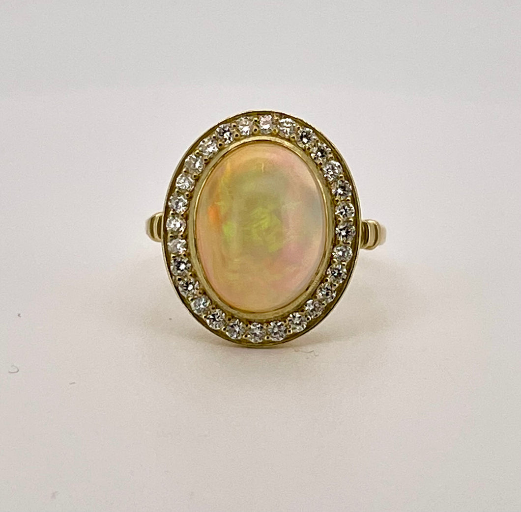 Oval Opal and Diamond Halo Ring in 18ct Yellow Gold