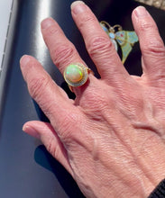 Load and play video in Gallery viewer, Oval Opal and Diamond Halo Ring in 18ct Yellow Gold
