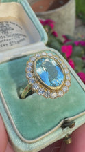 Load and play video in Gallery viewer, Vintage Aquamarine &amp; Diamond Halo Ring in 18ct Yellow Gold
